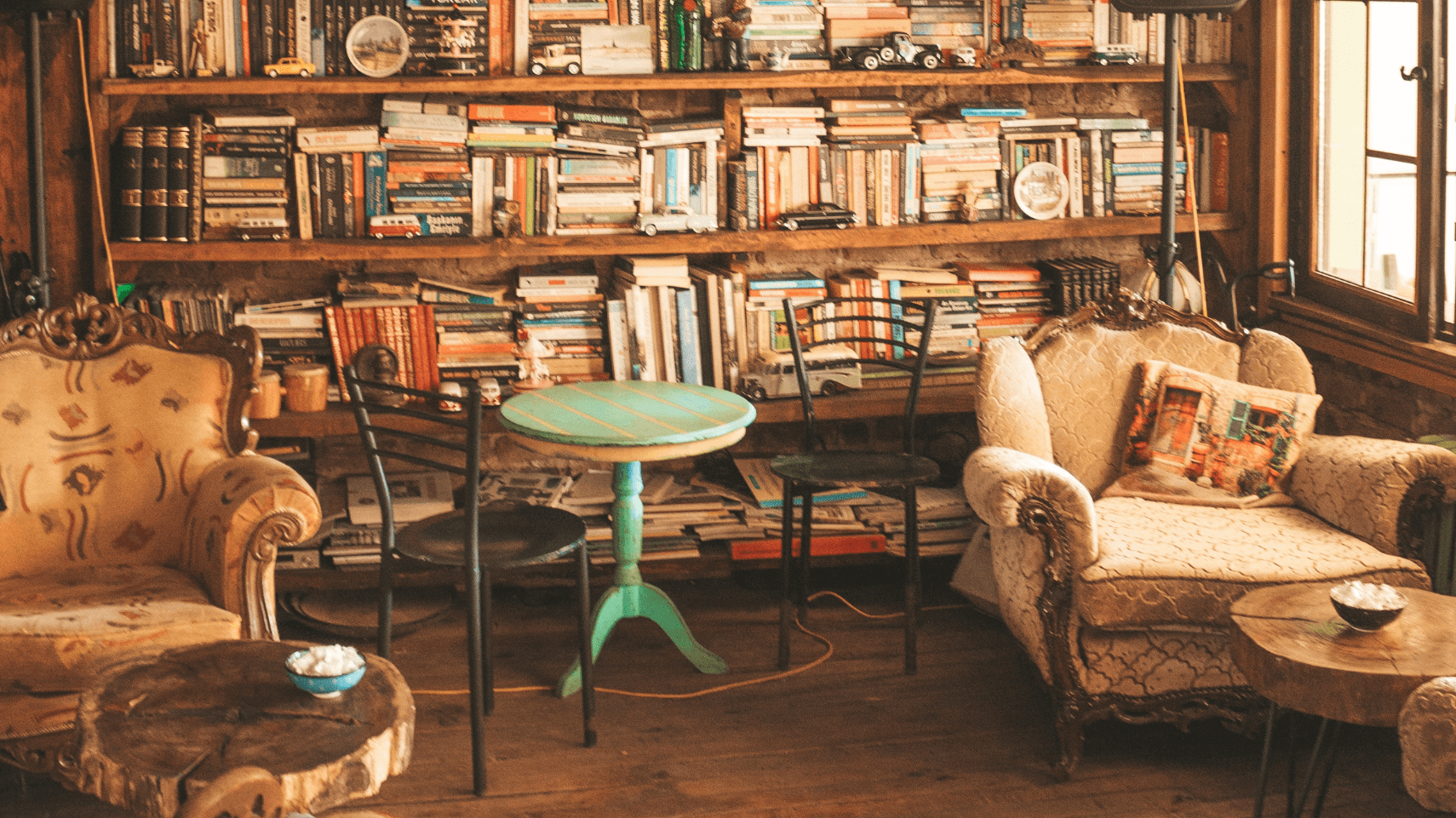 Cozy room with bookshelves and vintage furniture.
